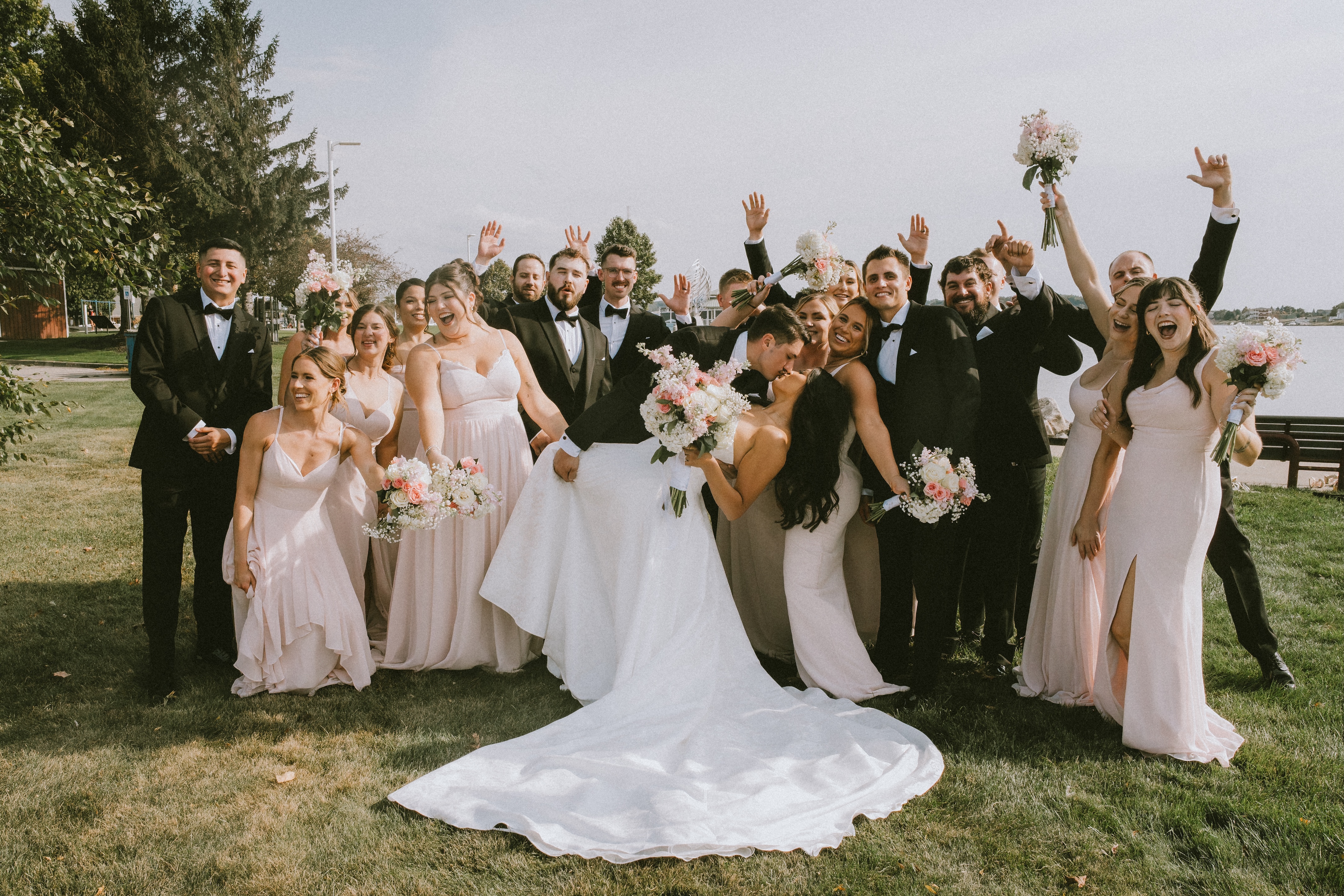 Wedding party celebrating together outdoors
